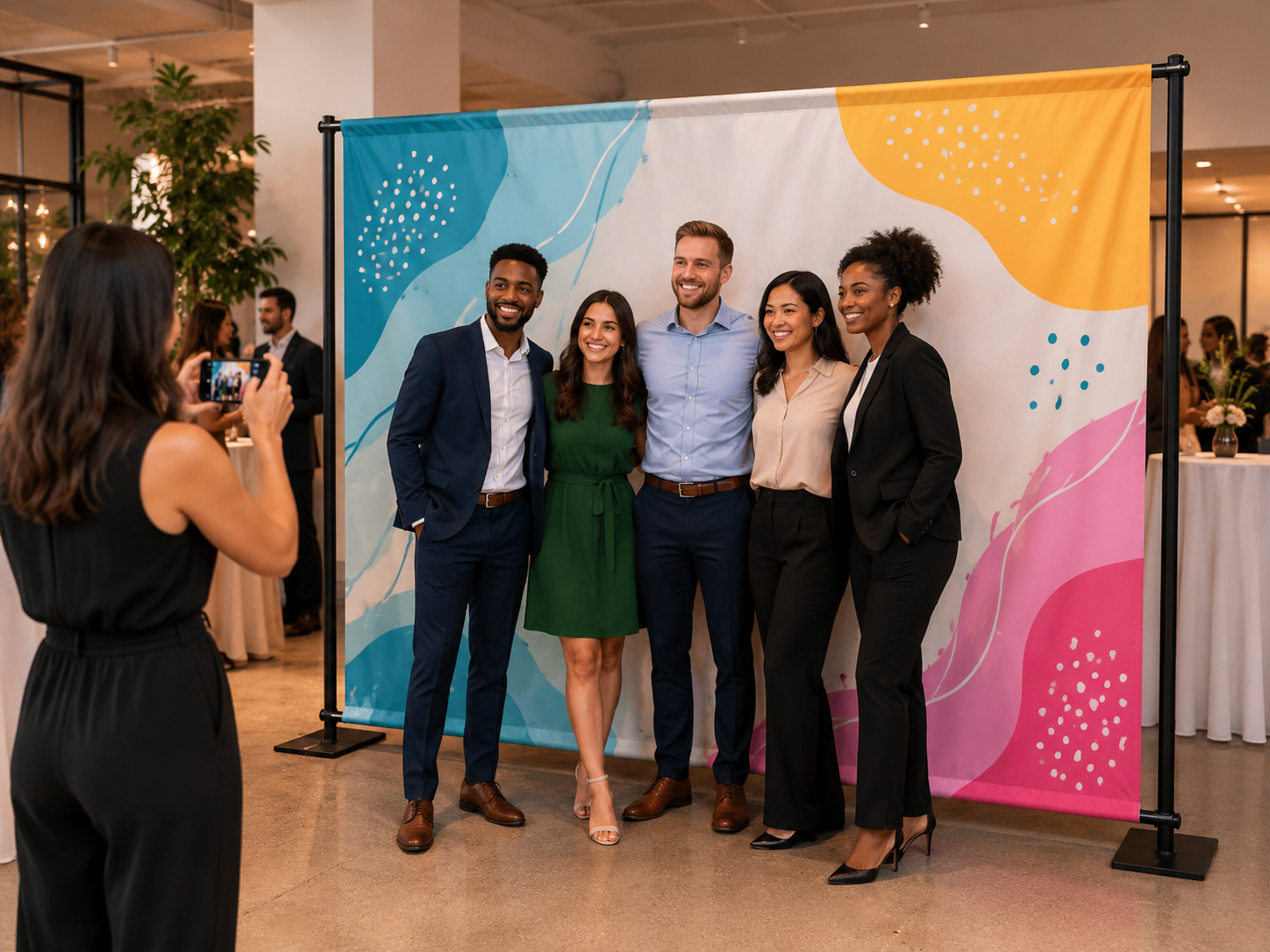 Shop custom fabric banners and backdrops with hems, grommets, and pole pocket options for events, trade shows, retail displays, photo backdrops, and branded spaces.